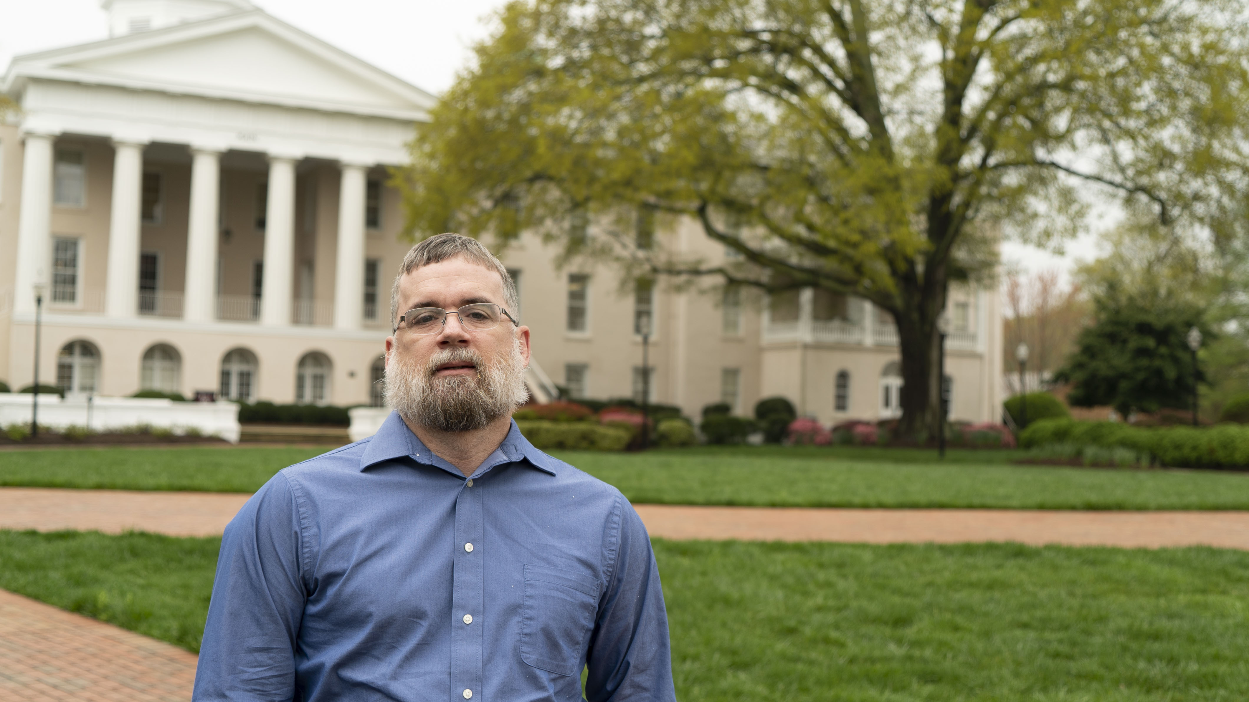 Alan Bradfords stands in front of Main Building on the Statesville Campus. 