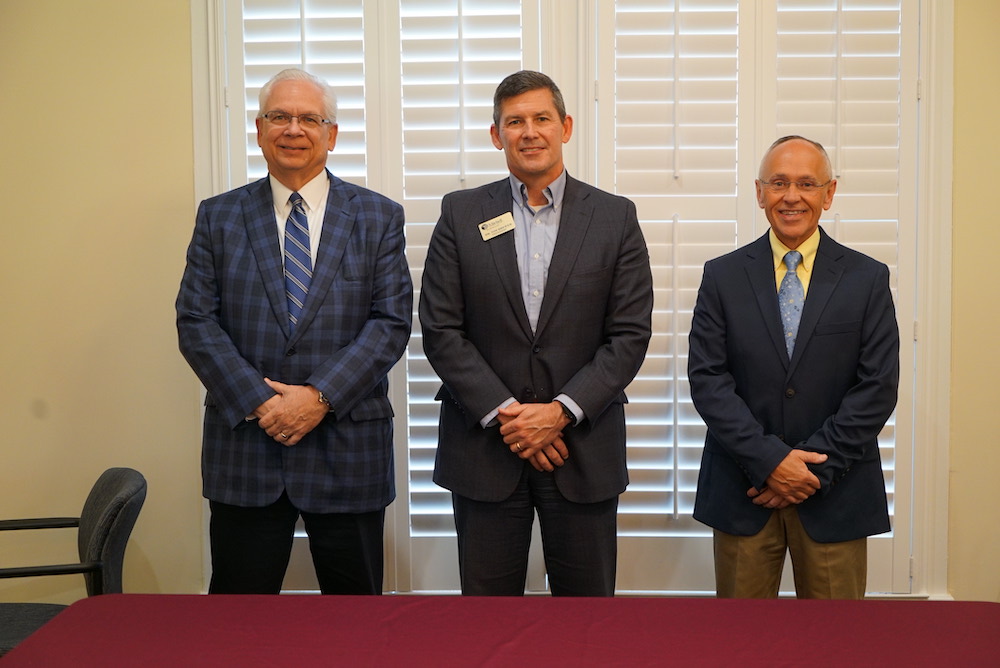 Jeff Smith, CEO (left) and Jeff Taylor, Director of Operations and Human Resources (right) of Piedmont HealthCare are pictured with Dr. Tim Brewer, president of Mitchell Community College (center).