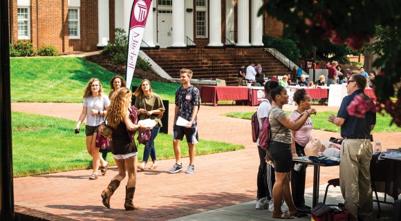 Students visit information booths around the Statesville Campus Circle