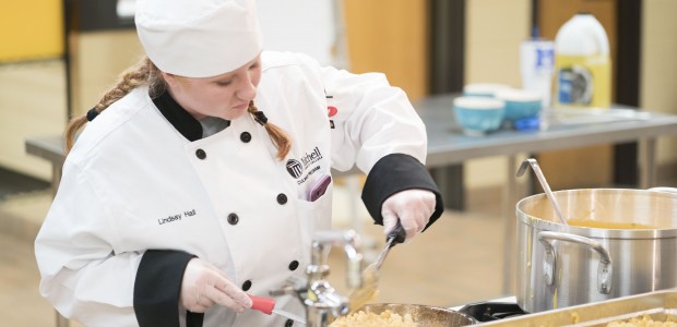 A culinary student prepares food.